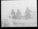 Image of Three White men on sledge